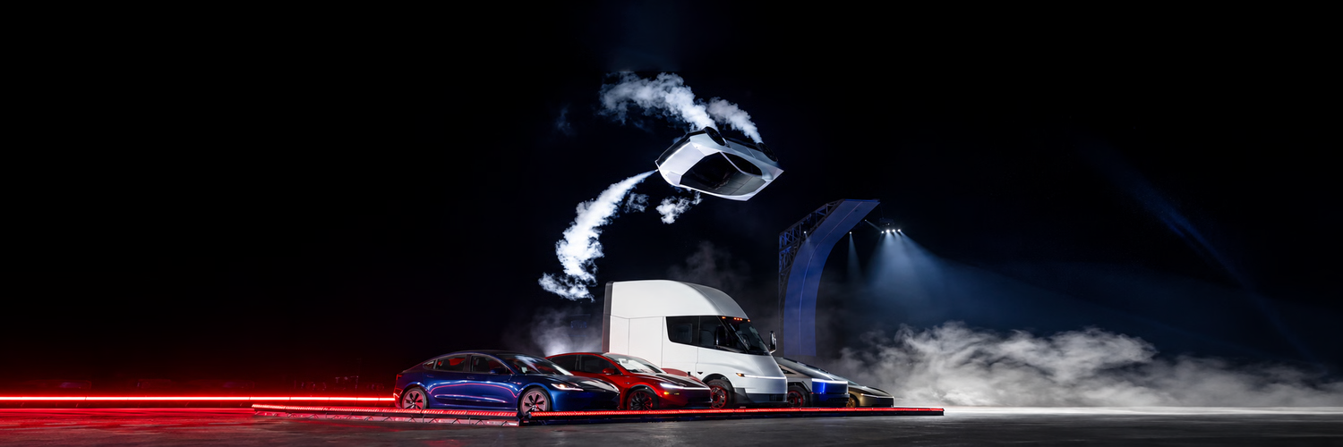 A futuristic flying vehicle above a roadway at night.